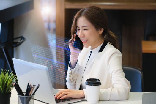 digital technology, Business woman using computer laptop to trade charts to find buy and sell points for her port