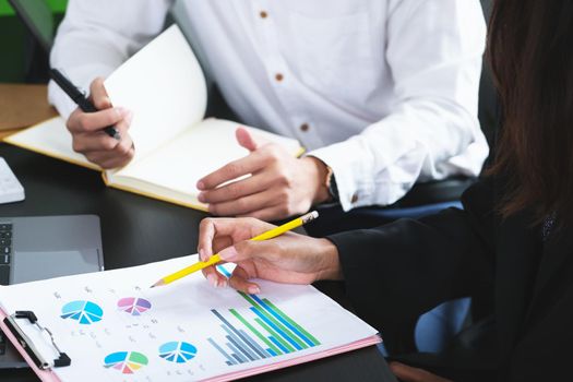 Two young business executives are discussing to change their business concept to increase profits and the strength of their business