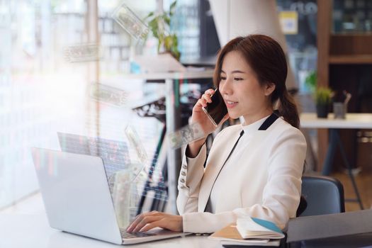 Business woman using computer to trade charts to find buy and sell points for her port