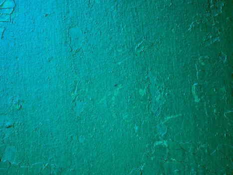 Old green concrete wall with cracked paint, background texture. high quality photo.