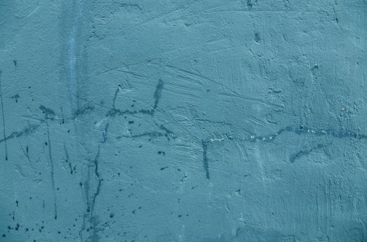 Old green concrete wall with cracked paint, background texture. high quality photo. Metal surface with old damaged green paint.