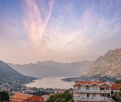 Sunset, beautiful landscape with silhouettes of trees. Travel concept. Montenegro, Kotor Bay. Sunset at Kotor Bay Montenegro. View of the sunset in Boko-Kotor Bay in Montenegro.