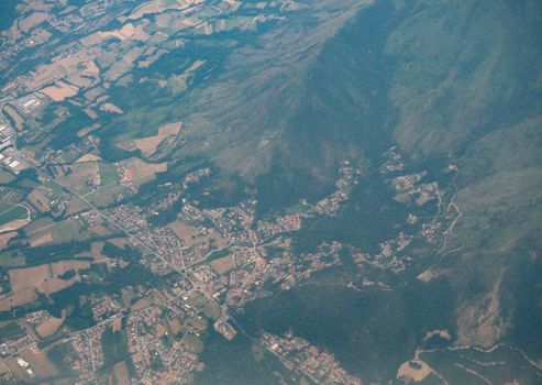 aerial view of a city surrounded by mountains