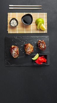 Teriyaki chicken is a traditional Japanese frying method using a sweet sauce common in Japanese cuisine. Chicken teriyaki is a classic Asian dish. Top view, flat lay and blank space for text.