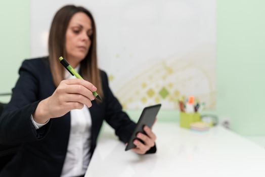 Businesswoman Having Tablet On Desk And Pointing New Ideas With Pen.