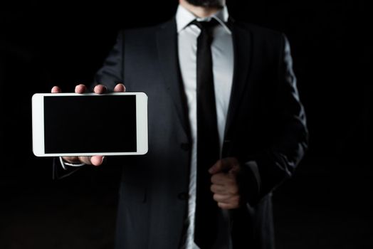 Businessman Presenting Important Informations On Phone Screen.