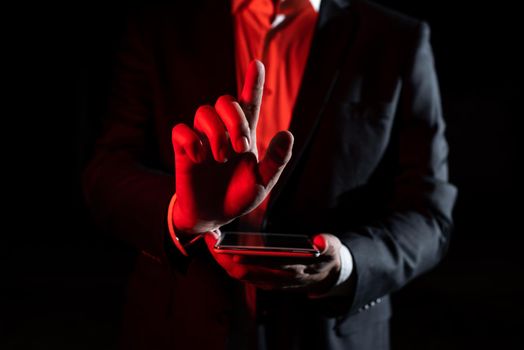 Man Holding Tablet And Pointing With One Finger On Important Message