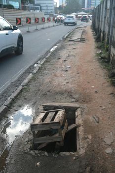 salvador, bahia, brazil - july 19, 2022: Pedestrian sidewalk with damaged floor on a street in Salvador city.