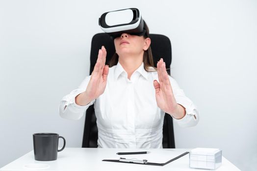 Woman Wearing Headset And Learning Skill Over Virtual Reality Simulator.