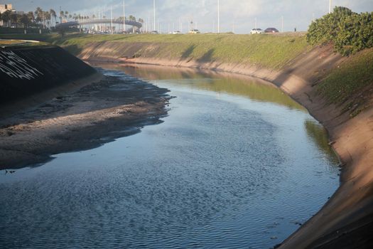 salvador, bahia, brazil - july 19, 2022: view of a sewage water channel on the Camurujipe river in the city of Salvador.