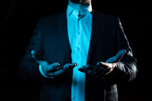 Businessman Holding And Presenting Important Informations On Hands.