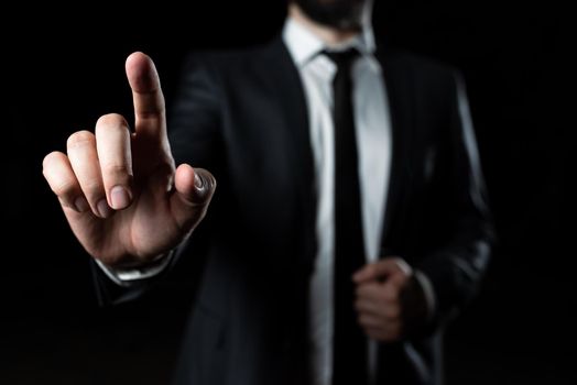 Businessman In Suit Pointing With One Finger On Important Message.