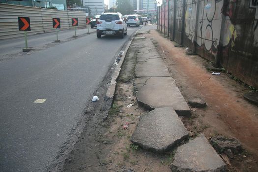 salvador, bahia, brazil - july 19, 2022: Pedestrian sidewalk with damaged floor on a street in Salvador city.