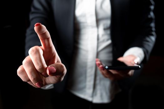 Businesswoman Holding Cellphone And Pointing New Ideas With One Finger.