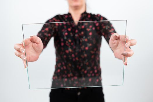 Businesswoman Holding Glass Banner For Promoting The Company.