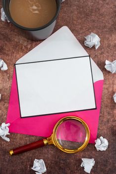 Letter With Envelope And Magnifying Glass Presenting Crucial Plans.