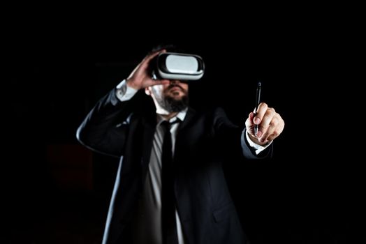 Man Wearing Virtual Reality Simulator Holding Pen During Training.