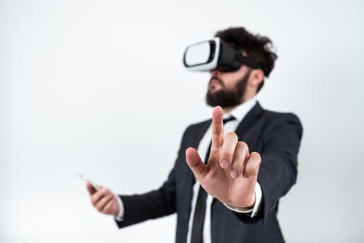 Man Wearing Vr Glasses And Pointing On Important Messages With One Finger.