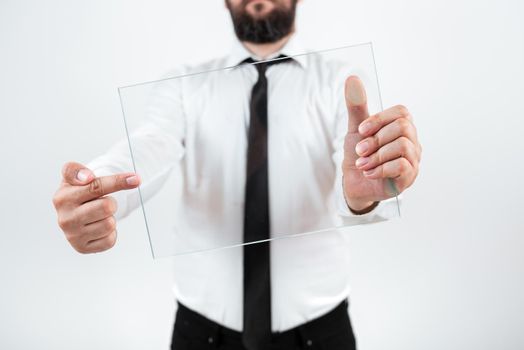 Businessman Pointing At Glass And Showing New Ideas To Achieve Goals.