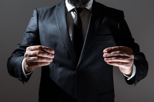 Businessman In Suit Holding Important Informations Between Hands.