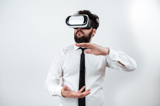 Man Wearing Vr Glasses And Presenting Important Messages Between Hands.