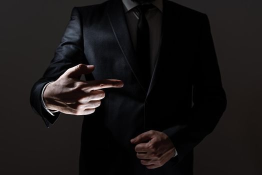 Businessman In Suit Pointing With One Finger On Important Message.