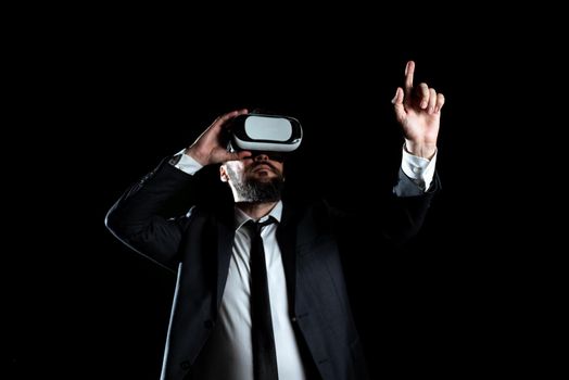 Businessman Wearing Suit Gesturing And Wearing Virtual Reality Simulator.