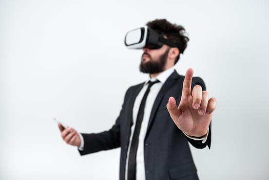 Man Wearing Vr Glasses And Pointing On Important Messages With One Finger.