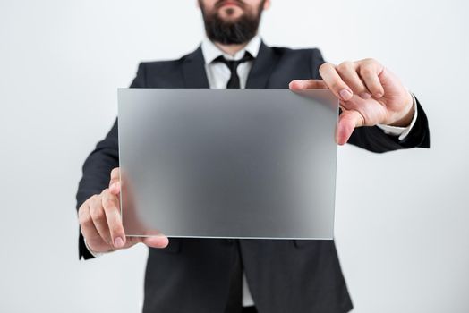 Male Professional Showing Placard And Advertising The Company.