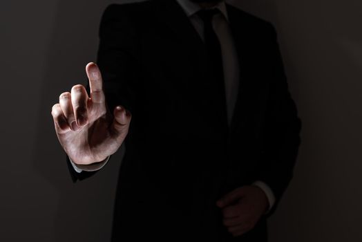 Businessman In Suit Pointing With One Finger On Important Message.