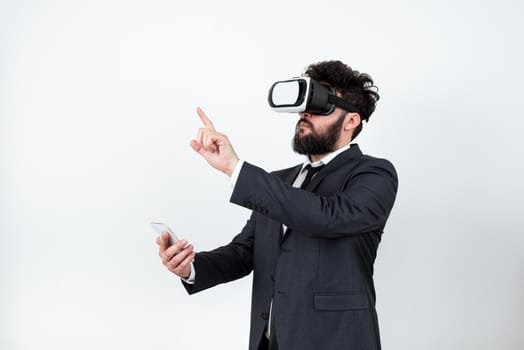 Man Wearing Vr Glasses And Pointing On Important Messages With One Finger.