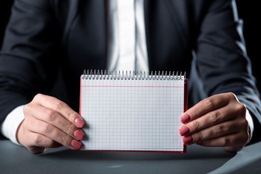 Businesswoman Holding Note With Important Message With Both Hands.