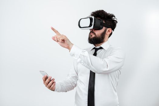 Man Holding Mobile Phone, Wearing Vr Glasses And Pointing On New Idea.