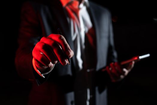 Businessman Holding Tablet And Pointing With Pen On Important Message.