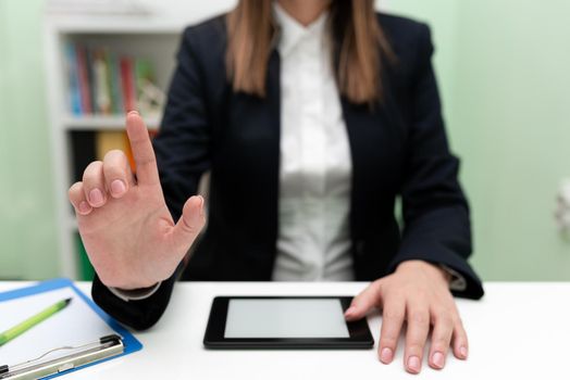 Businesswoman Having Tablet On Desk And Pointing New Ideas With One Finger.