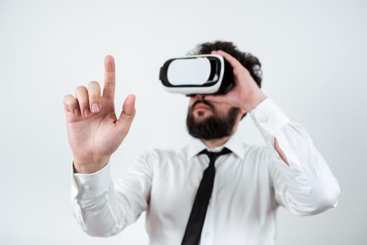 Man Wearing Vr Glasses And Pointing On Importantt Messages With One Finger.