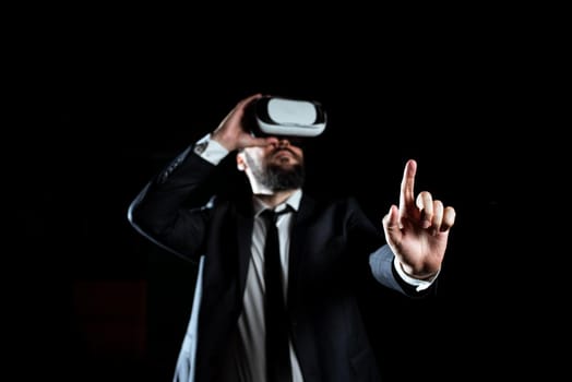 Businessman Wearing Suit Gesturing And Wearing Virtual Reality Simulator.