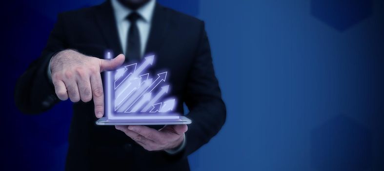 Businessman in suit holding tablet symbolizing successful teamwork.