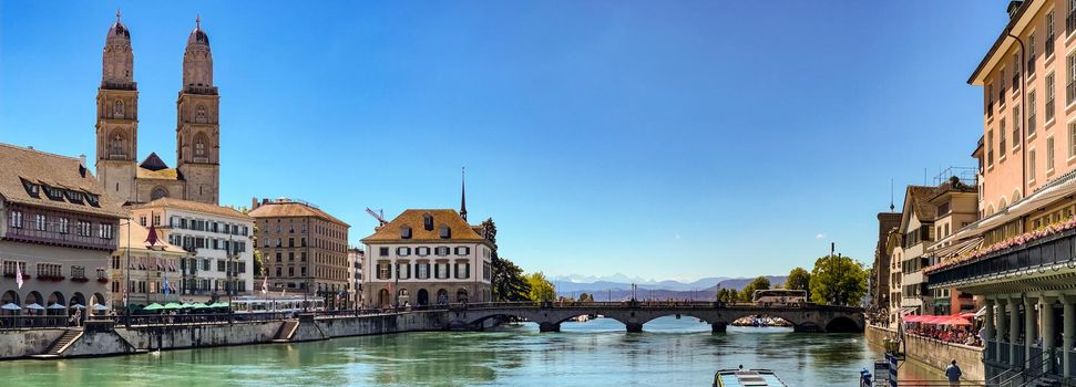 Picturesque panoramic view of the Limmat River, the Munster Bridge and the Grossmunster in Zurich, Switzerland