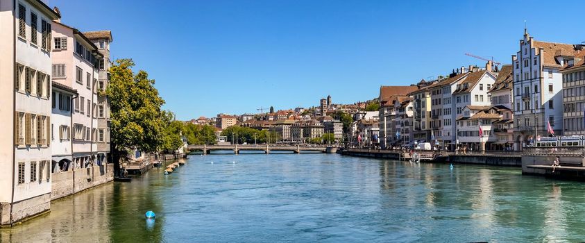 Poster view of Zurich with the Limmatquai promenade and the view down the river to the city of Zurich, Switzerland