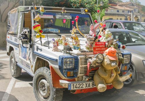 BEDOIN, FRANCE - AUGUST 3, 2016: Plush toys decoration on a jeep for tourists in Provence, Mont Ventoux