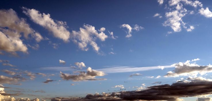 White clouds in a beautiful sky and its reflection