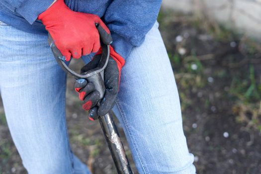 Cropped photo of a person ploughing the land of a farm