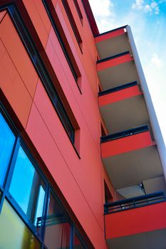 Modern red building with offices and glass windows