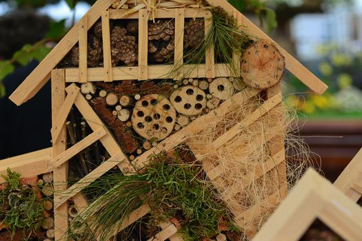 Wooden hotel for insects Decorative house Closeup