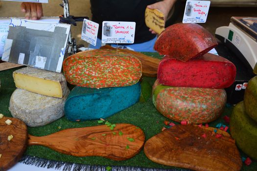 BEDOIN, FRANCE - AUGUST 1, 2016: French cheese of differents color at the market in Provence.France.