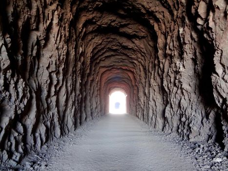 Tunnel made for trains to pass through the mountains as part of Hoover Dam Railroad system.  Tunnel is approximately 300 ft. in length, and 25 ft in diameter. The tunnels were oversized to fit penstock sections and large equipment being transported to Hoover Dam.  Now part of the The Historic Railroad Trail.                       