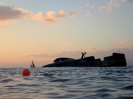 Honolulu - November 3, 2017: Shipwreck fishing boat off the coast of Oahu. The crash of the 79-foot (24-meter) Pacific Paradise. had about 1,500 gallons (5,700 liters) of diesel and hydraulic oil left in its tanks after the vessel caught fire days after the October 10 crash.