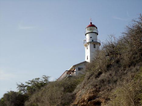 Diamond Head Lighthouse on Oahu.  Diamond Head Lighthouse is a United States Coast Guard facility located on Diamond Head in Honolulu, on the island of Oʻahu in the State of Hawaiʻi. The lighthouse was listed on the National Register of Historic Places in 1980.