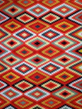 Pattern Red, Orange, White, Green, Black, and blue Diamond Blanket/ Rug - Navajo Artist, made about 1885 of cotton and wool.                              